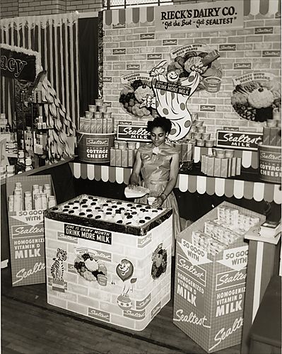 Trade fair in gymnasium: promotion display for Rieck's Dairy Co.