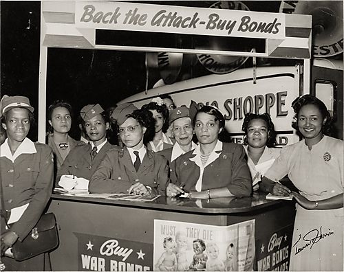 Ruth Gwynnon, organizer of the campaign, and other women selling war bonds