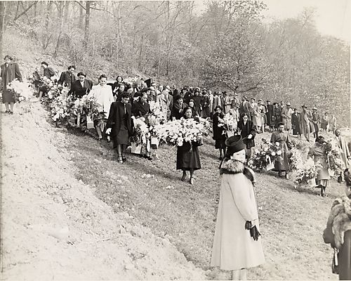 Pigmeat's funeral, Allegheny Cemetery in Lawrenceville, including Kathleen Halloway near center with round, light-colored brooch