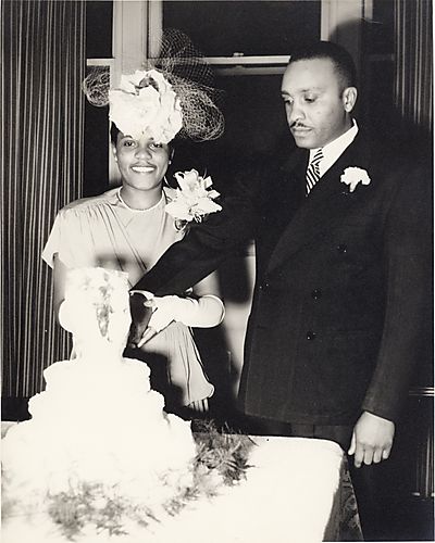 Bride and groom cutting cake