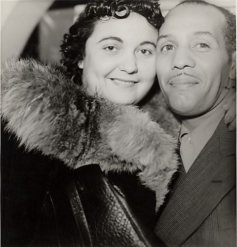 Woman and man cheek-to-cheek