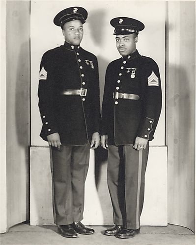 Two men standing in dress military uniforms