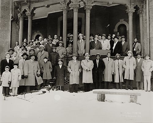Group portrait of The Frogs outside the Wesley Center on Centre Avenue