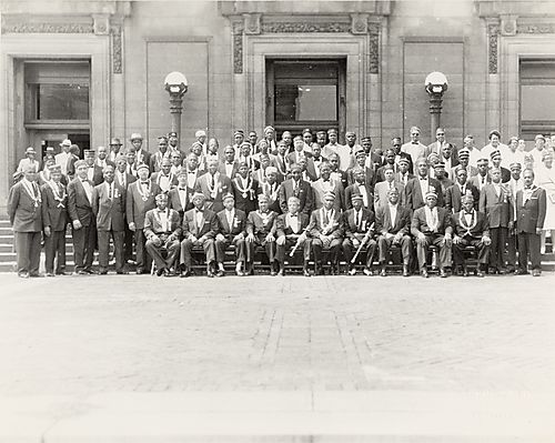 Group portrait of the Masons outside Syria Mosque in Oakland