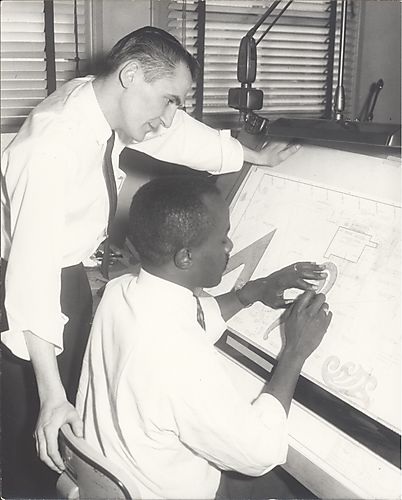 Two men at drafting table