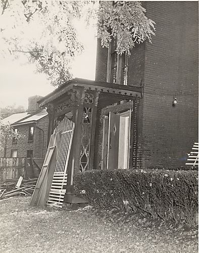 Porch of house with scrap wood pile
