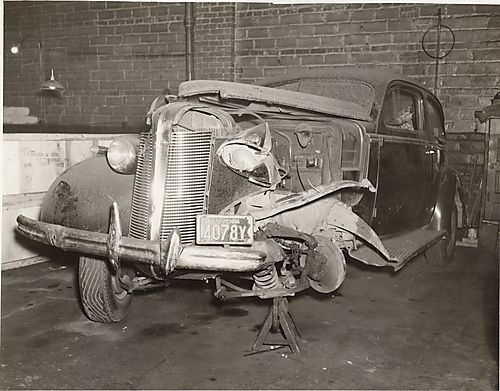 Heavily damaged Buick Century Sport Coupe model 66s car in garage