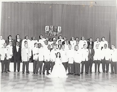 Group portrait of men and a beauty queen at the Frogs' annual formal dance