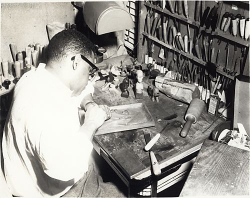 K. Leroy Irvis carving wood