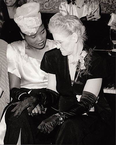 Mrs. Maudelena Johnson (in black) and another woman, possibly Mary Dee, seated in front of a piano at the North Side Elks' Club