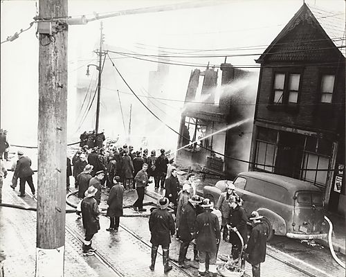 Fire fighters from Wilkins Township No.3, Dravosburg, and F[orest] H[ills] departments fighting a fire