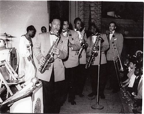 The Wil Hitchcock band: four saxophonists and trombone player Wil Hitchcock performing