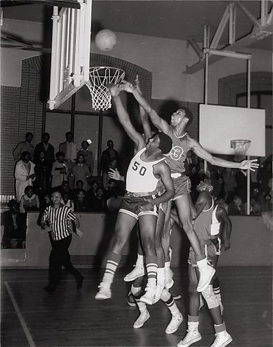 Westinghouse High School forward Allen Lee rebounds for basketball against center from Fifth Avenue High School