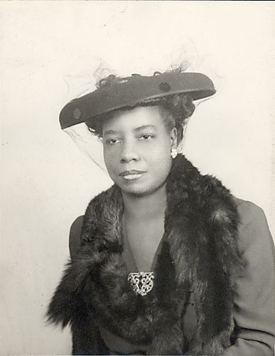 Portrait of a woman in hat with veil and fur stole