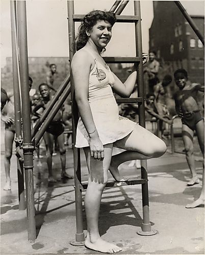 Woman in bathing suit at base of ladder at Ammon Recreational Center, Hill District