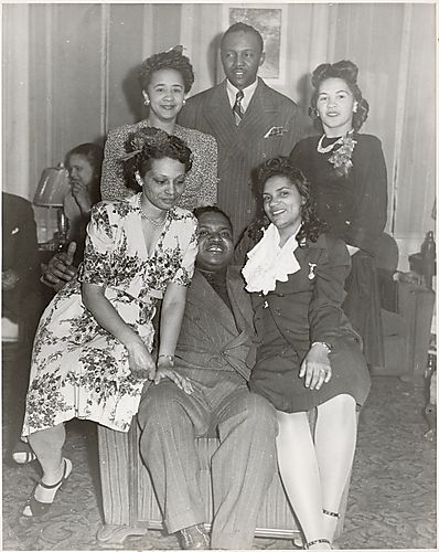 Group portrait, possibly including numbers man Cost Blunt and Fannie Brice seated on the right
