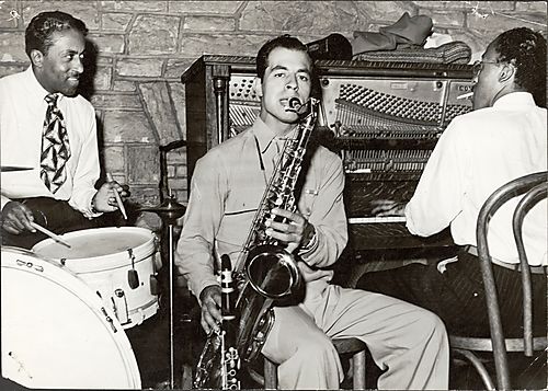 Jazz group with drummer Bob Dews (Father Hunz") and saxophone and piano players at The Ritz Club"