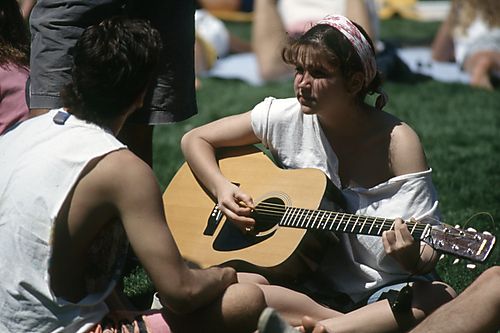 Girl Playing the Guitar on the Cathedral Lawn