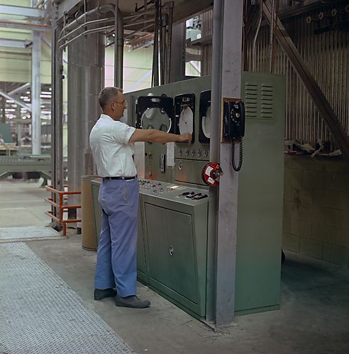 Man adjusting machine