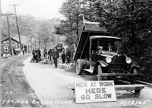 Butler Plank Road - men laying brick road