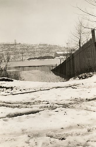 Fence Disappears Underneath Flood Waters