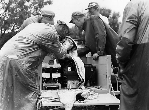 Men working on model trains