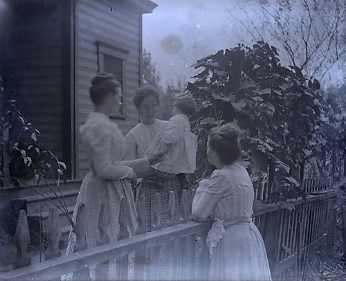 Women Talking Over Fence (2)