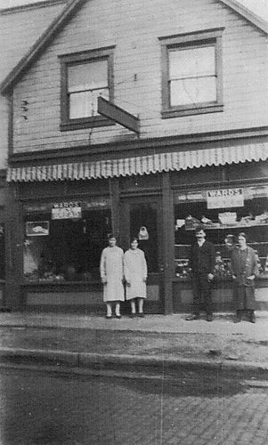 Four People In Front of Kokales' Market