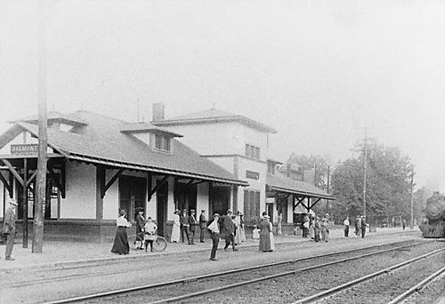 A Crowd Stands Outside the Oakmont Station