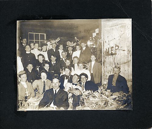 A group photograph with corn husks