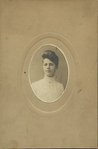 Portrait of a young woman in a white dress
