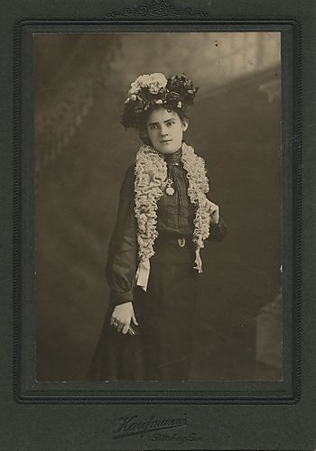 Portrait of a woman wearing an ornate hat