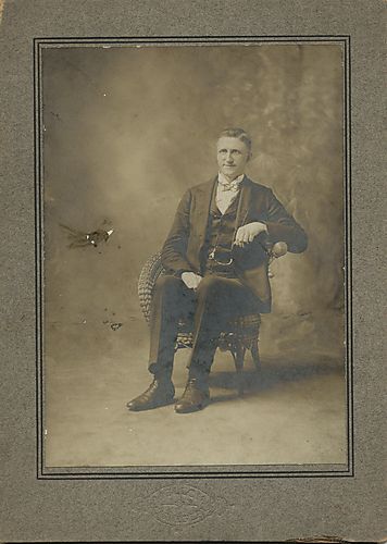 Portrait of a man sitting in a chair