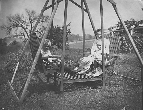 Gilfillan family members in a swing