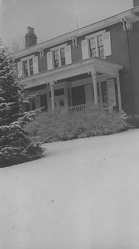 Gilfillan house in snow, old wide porch