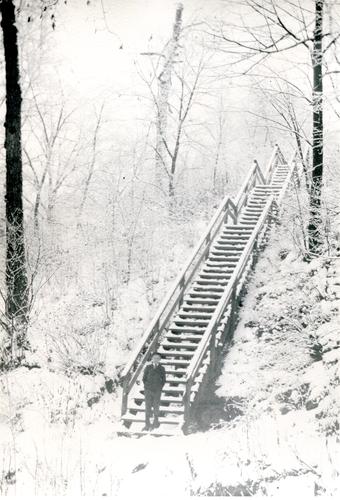 Boy on Snowy Staircase