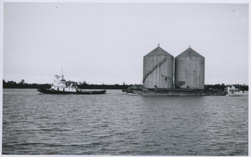 Boat towing ore tanks