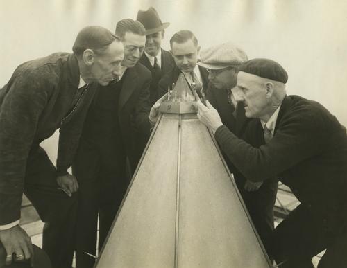 Engineers and metallurgists inspect the Washington Monument cap
