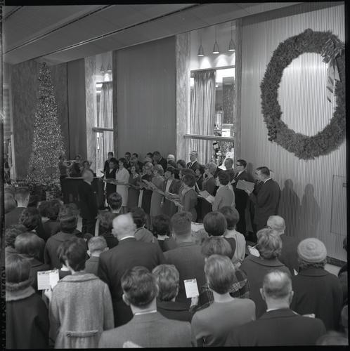Christmas carolers in the Alcoa Building