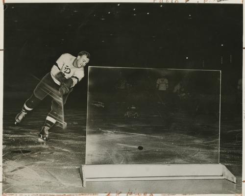 Herculite glass tested by Pittsburgh Hornets hockey player at Duquesne Gardens