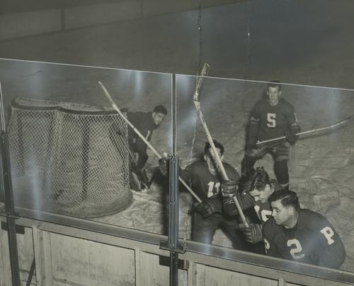 Herculite glass tested by hockey players at Duquesne Gardens