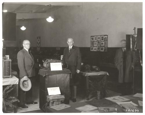 F.A. Merrick and Henry Ford with first transformer at Ford Museum Engineering exhibit