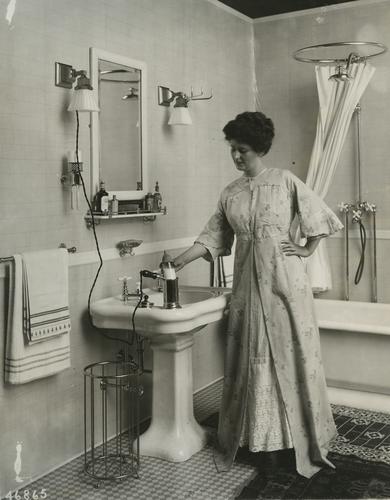 Woman demonstrating the Westinghouse baby bottle warmer