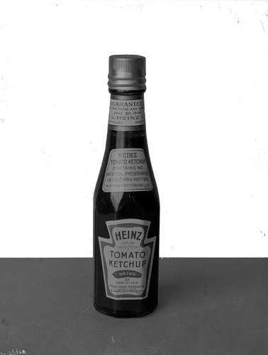 A bottle of Heinz Tomato Ketchup.