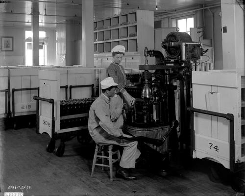 Heinz employees working at the capping machine