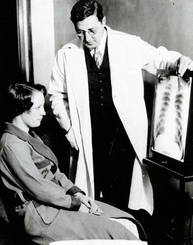 Doctor and patient reviewing a lung x-ray