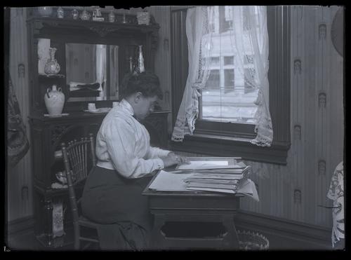 Blind woman at a desk