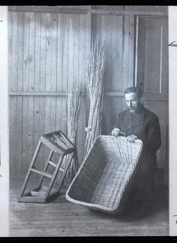 Man displaying woven basket