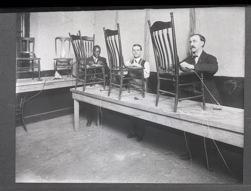 Blind men caning chair seats