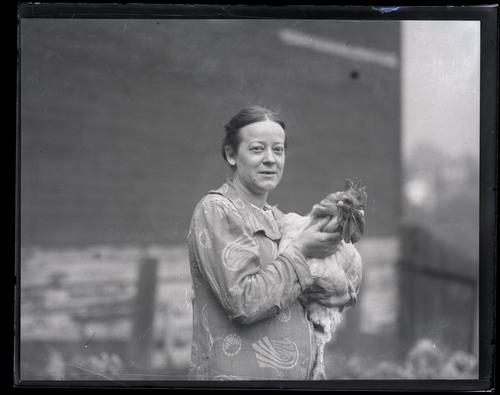 Woman Holding Rooster